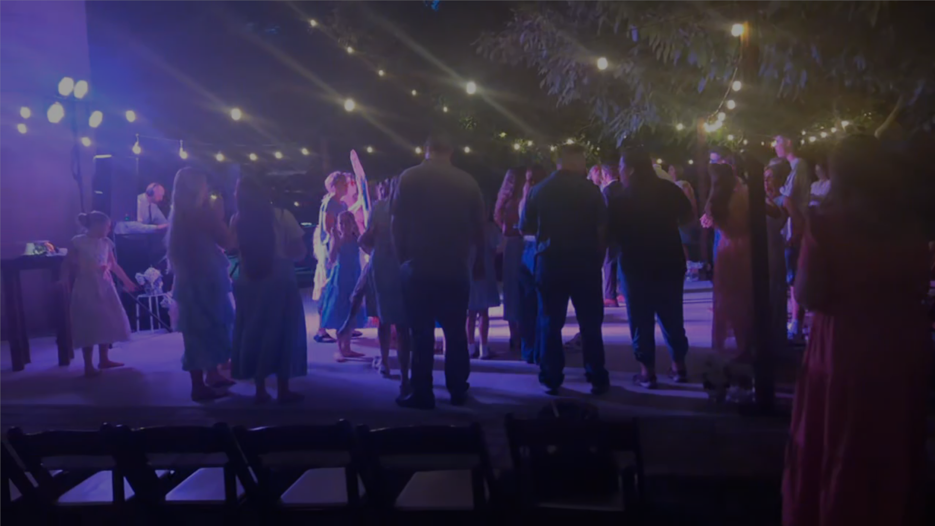 Large group dancing at a wedding reception while listening to voyager mix mobile dj.
